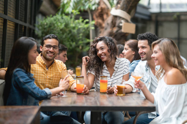 istock Happy group of friends having drinks at a restaurant 862404200