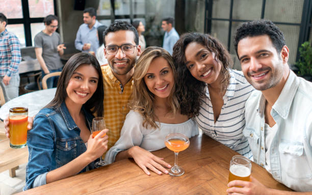 istock Happy group of friends having dinner at a restaurant 862404246