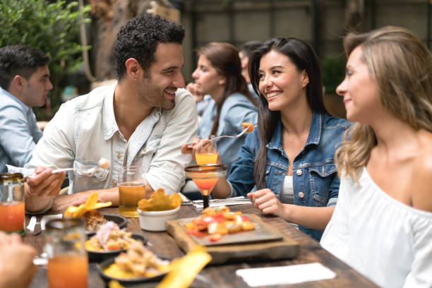 istock Group of friends having dinner at a restaurant 862404268
