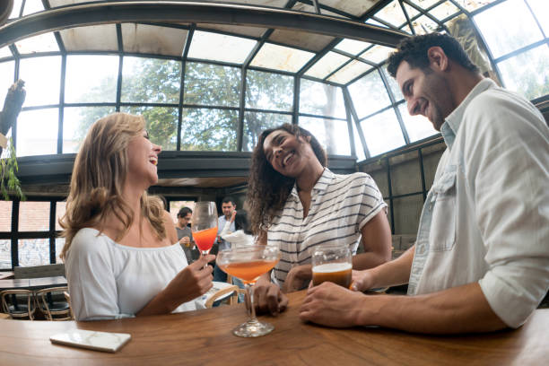 istock Happy friends having drinks at the bar 862404304