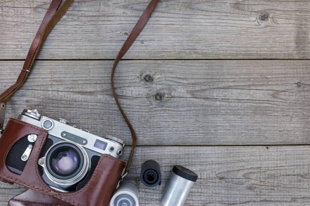 istock old still camera in brown leather case on wooden desk 862404308