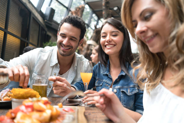 istock Group of friends having dinner at a restaurant 862404486