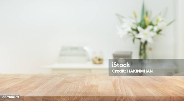 Real Wood Table Top Texture On White Wall Room Background Stock Photo - Download Image Now