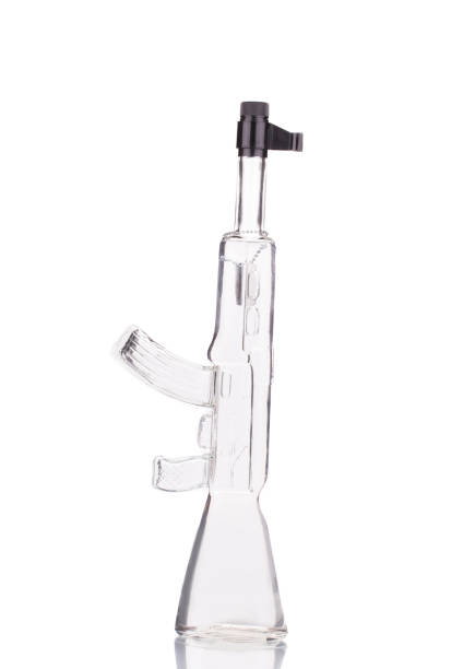 istock Glass of vadka Kalashnikov rifle. 862408928