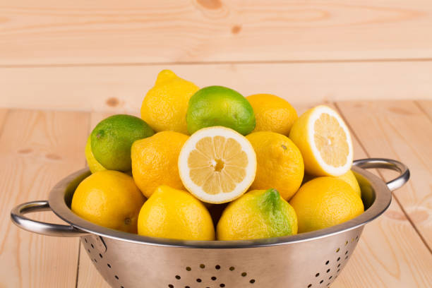 istock Lemons and limes in a metal colander. 862409156