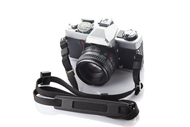 istock Old vintage film camera with strap isolated on white background 862415340