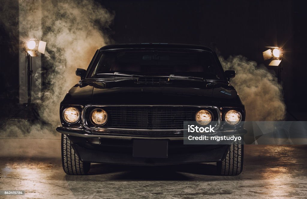 Classic black car in garage Car Stock Photo