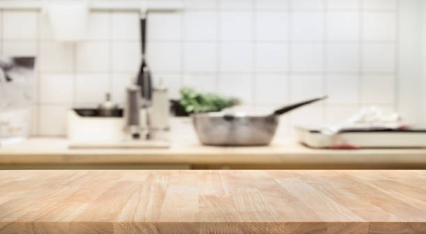 istock Wood table top on blur kitchen room interior background 862422232