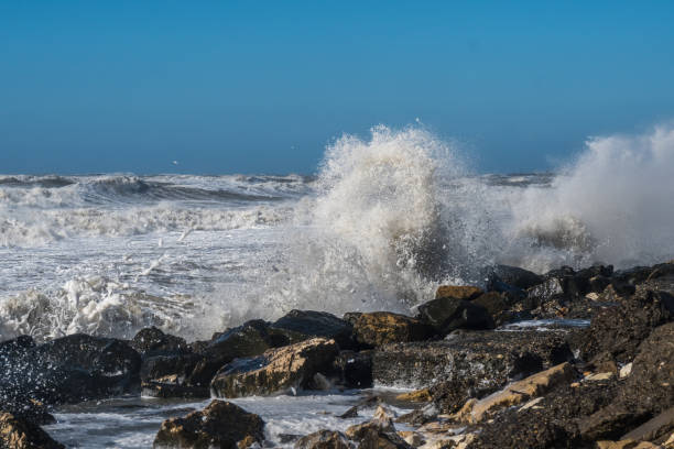 istock Stormy sea huge waves breaking near the coast 862422508