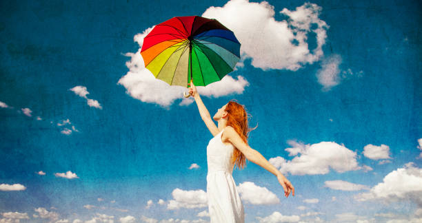istock Redhead girl holding umbrella 862422654