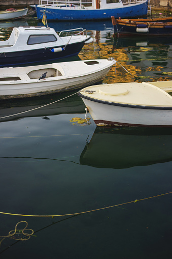 Small Plastic Boats Moored At The Pier A Quiet Morning On A