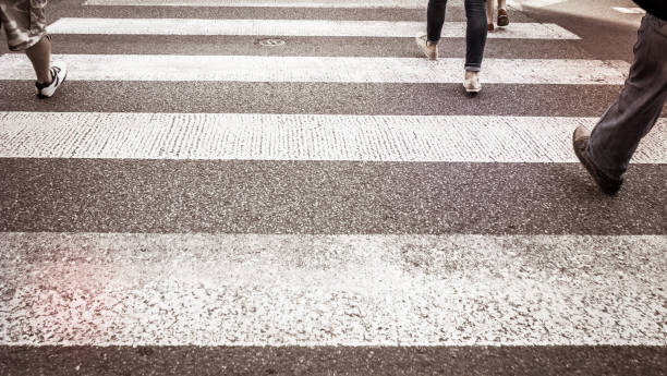 istock People crossing the road in town 862430346