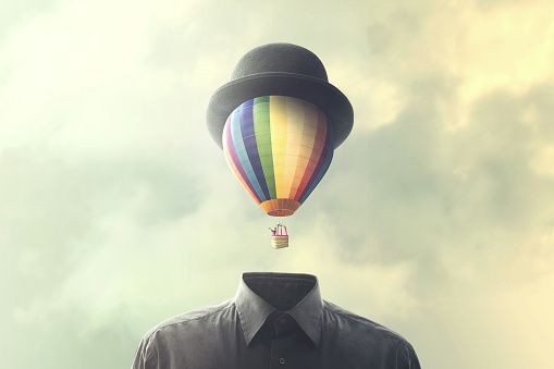 man with big balloon fly on his head, changement concept