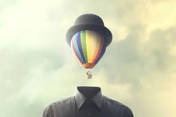 Photo of man with big balloon fly on his head, changement concept