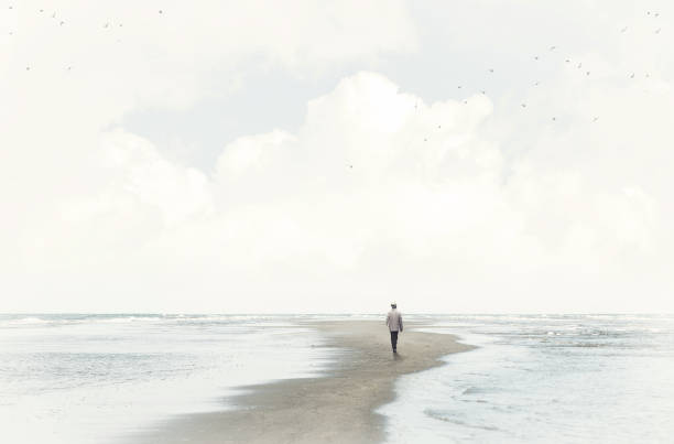 calm man walking in the sand between two seas