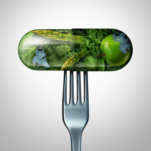 Natural Food Supplement Natural food supplement concept as a pill or medicine capsule with fresh fruit and vegetables inside on a fork as a nutrition and dietary vitamin symbol for good eating health and fitness lifestyle with a 3D render. mineral stock pictures, royalty-free photos & images