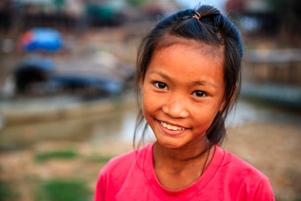 Portrait of happy Cambodian little girl, Cambodia Portrait of happy Cambodian little girl near Tonle Sap, Cambodia cambodian ethnicity stock pictures, royalty-free photos & images