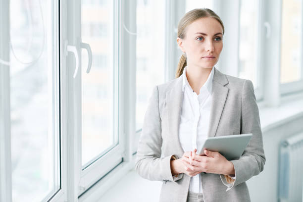 istock Purposeful young lady thinking of success 862447084