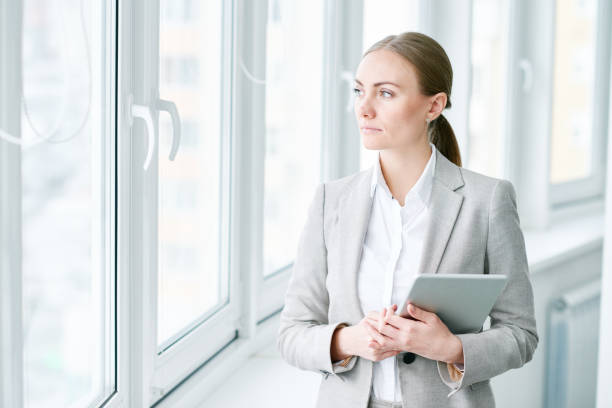 istock Pensive business consultant with device 862449242
