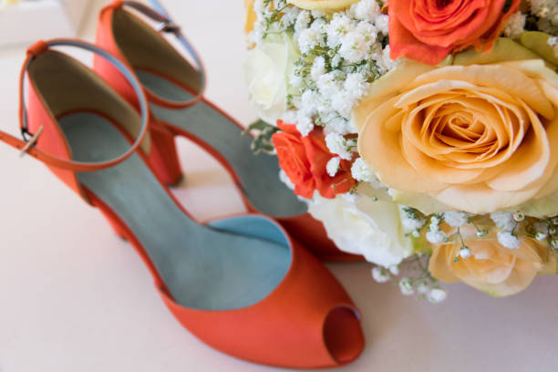 istock wedding bouquet with roses and wedding shoes 862453886