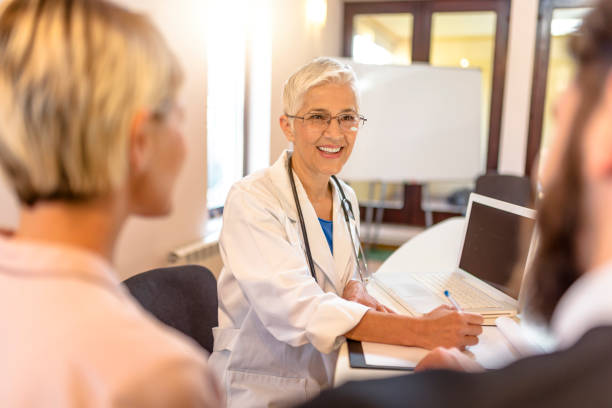 istock Female doctor talking with her patients 862461960