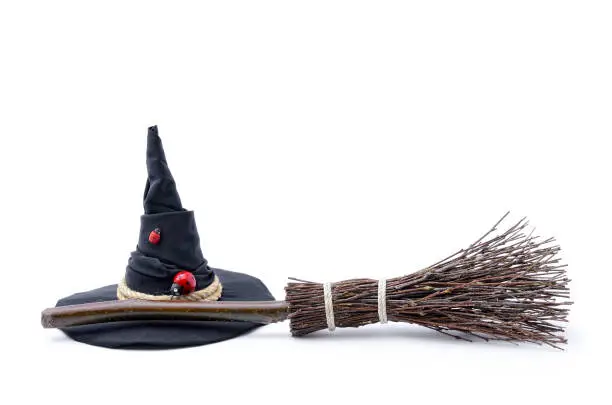 Magic Broom and Witch Hat on a White Background