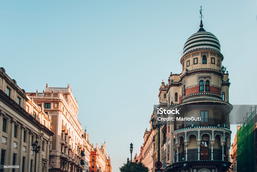 Avenida de la Constitucion, Seville, Spain. Beautiful buildings in Avenida de la Constitucion, Seville, Spain. Architectural Dome Stock Photo