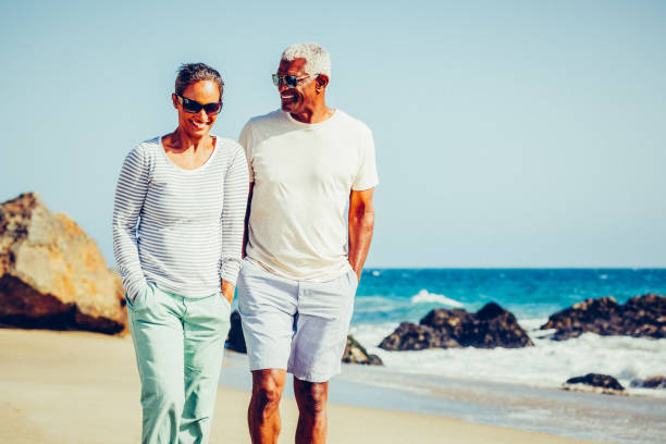 istock Senior African American couple walking at beach 862480800