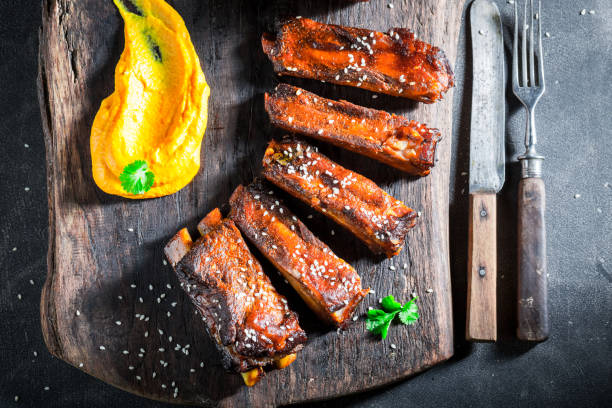 istock Delicious roasted ribs with sesame and vegetables 862488682