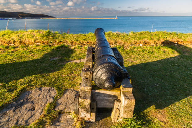 Cannon looking out to sea, Fishguard Fort, Pembrokeshire, Wales, United Kingdom