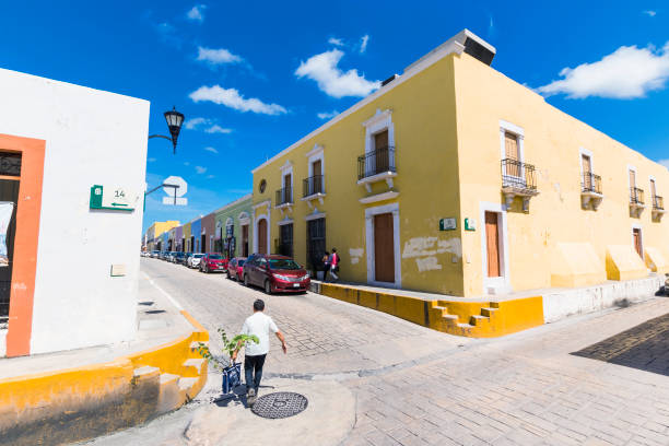 Campeche residents on daily activities, on the streets of the old city neighborhood, a UNESCO, world heritage site.