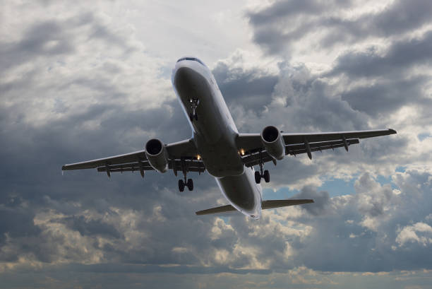istock Airplane flying in sky with beautiful clouds at sunset 862492246
