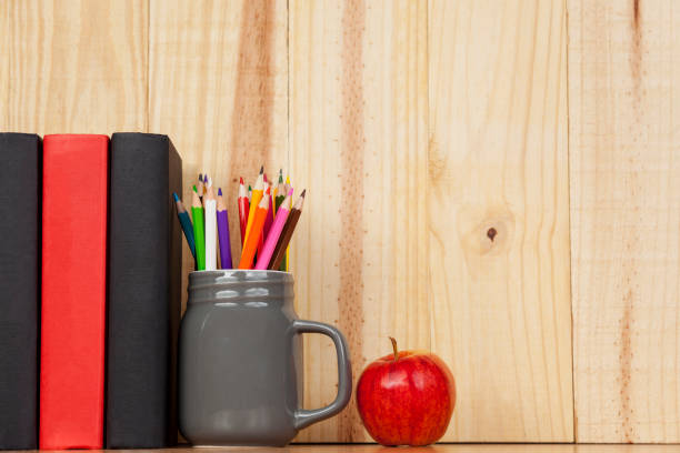 istock Books and pencil jar on a shelf with an apple 862492416