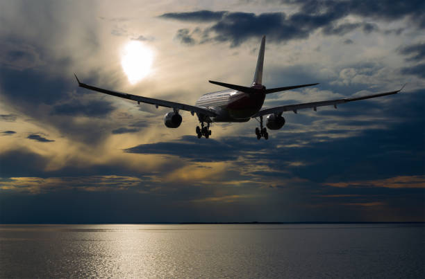 istock Airplane flying in sky with beautiful clouds at sunset 862494658