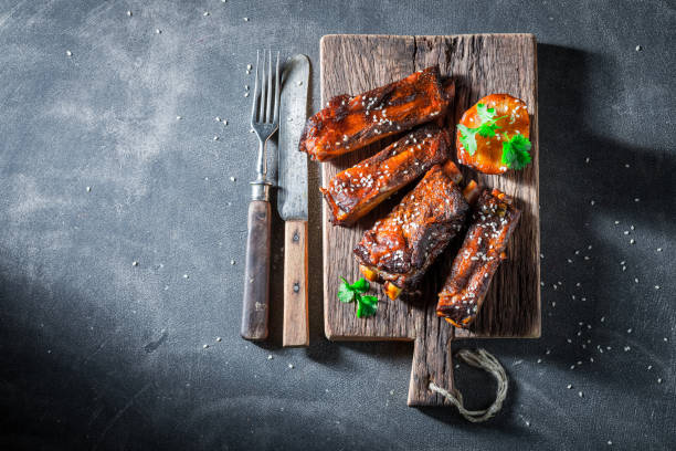 istock Tasty roasted ribs with vegetables and potato 862495004