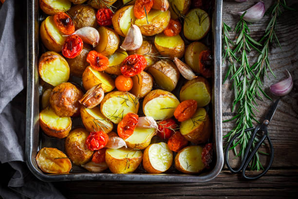 istock Crispy roasted potato with garlic, tomato and rosemary 862496360