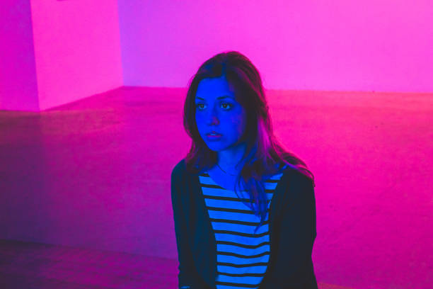 istock Girl in a pink and blue light 862501350