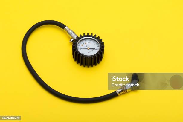 Tire Pressure Gauge Stock Photo - Download Image Now - Auto Repair Shop, Work Tool, Yellow