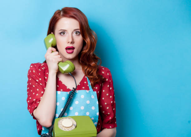 istock housewife with talking by phone and holding handset 862511666