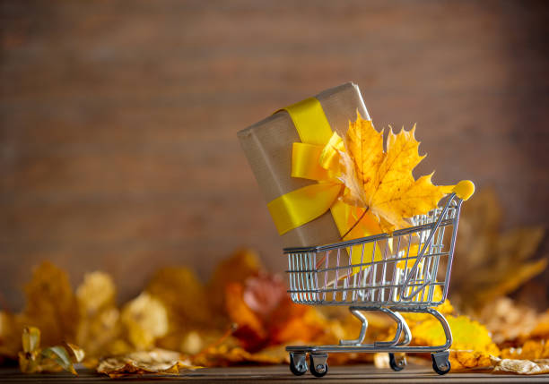 istock Vintage cart with gift box and maple tree leaves 862511940