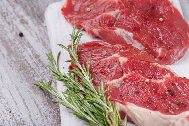 istock Raw fresh beef steak on a white cutting board 862518956