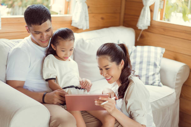 istock Asian family tablet are playing at home. 862528520