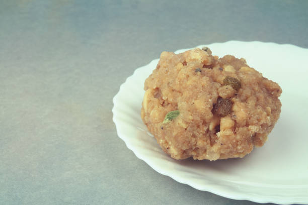 making stuffed meatballs. It was shot in a studio environment with a full frame camera. Minced meat is stuffed into dough made from bulgur.