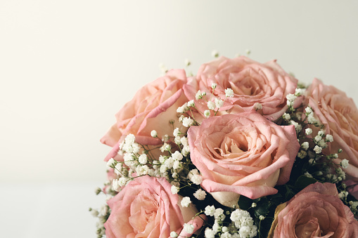 Red rose And pink beautifully arranged in a flower vase. Have romantic Decorate in important events such as wedding decoration in the building. And give it to the loved ones. copy space. Retro filter.