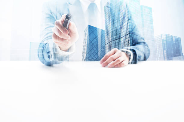 istock Businessman Holding a Felt Tip Pen with Double Exposure Cityscape 862529156