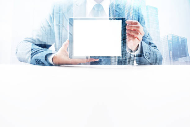 istock Businessman Showing Digital Tablet with Double Exposure Cityscape 862529240