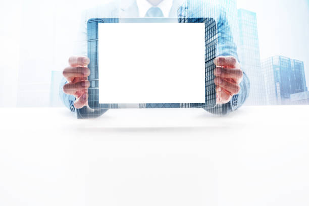 istock Businessman Showing Digital Tablet with Double Exposure Cityscape 862529278