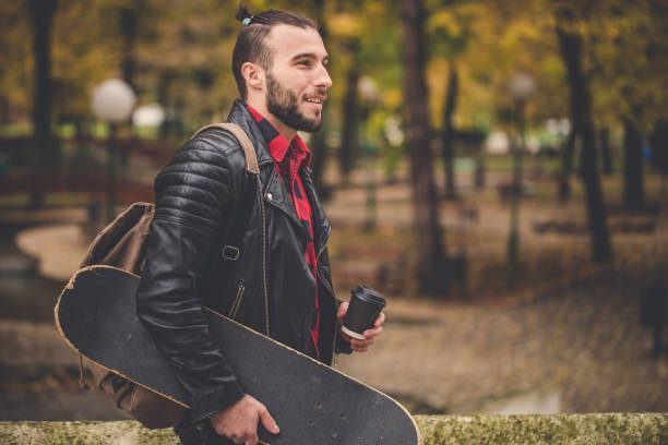 istock Skater man in park with coffee 862529304