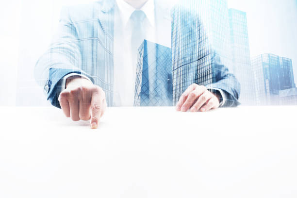 istock Businessman Pointing on Desk with Double Exposure Cityscape 862531342