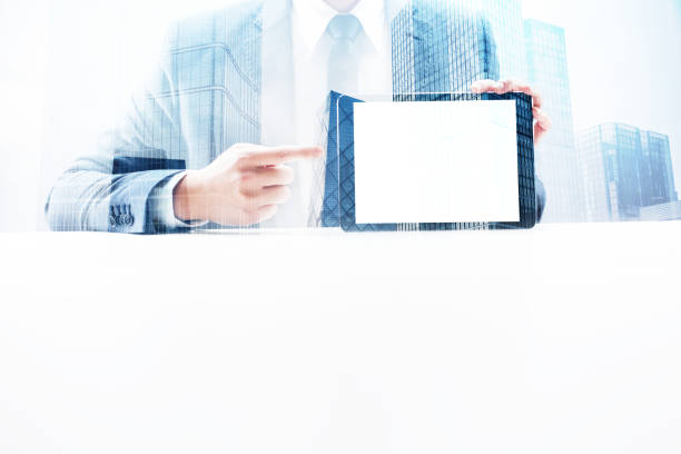 istock Businessman Showing Digital Tablet with Double Exposure Cityscape 862531916